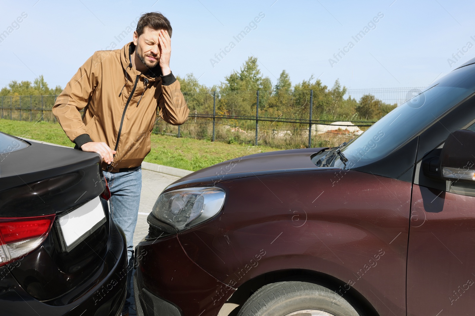 Photo of Stressed man near car with scratch outdoors. Auto accident