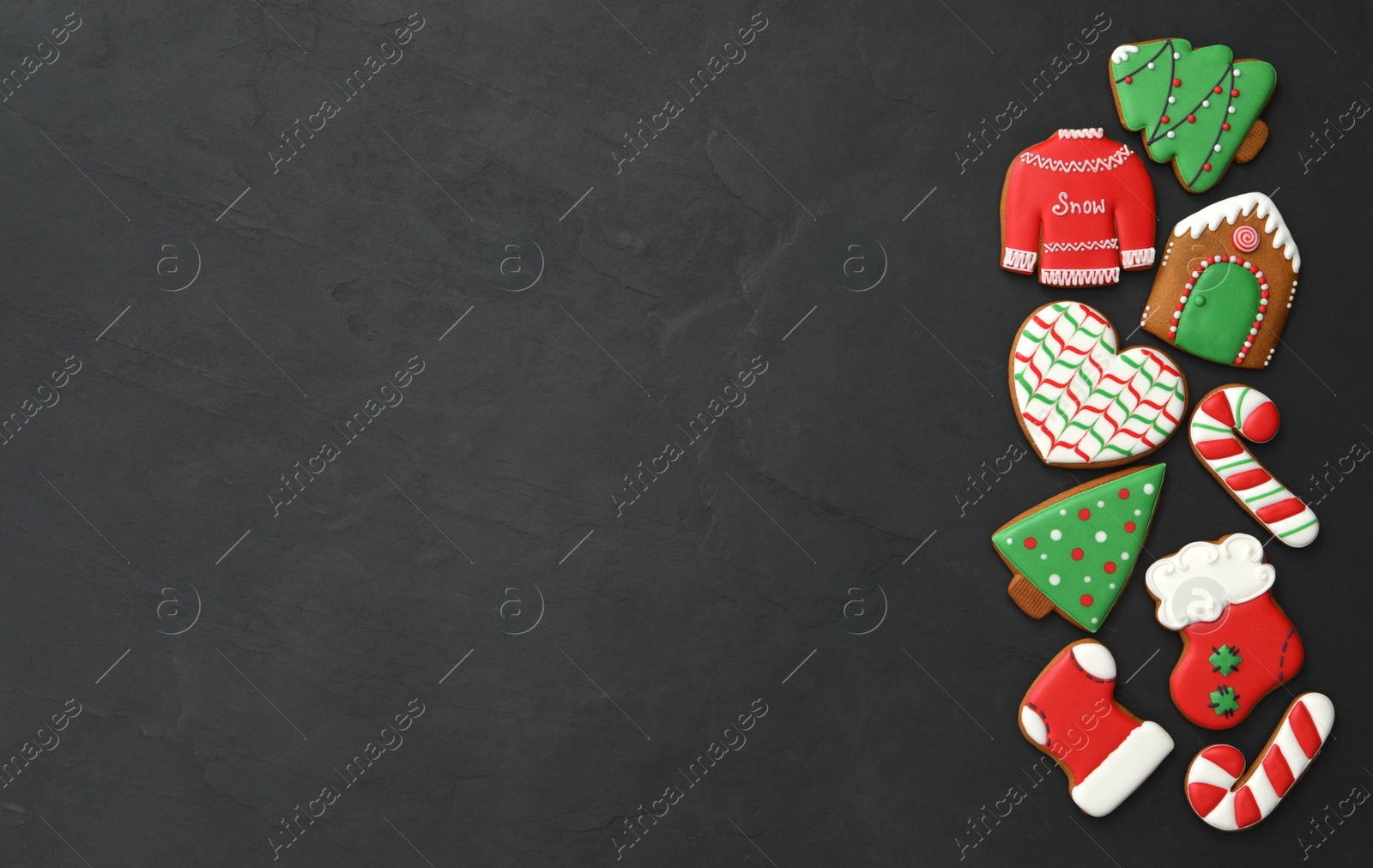 Photo of Many different delicious Christmas cookies on black table, flat lay. Space for text