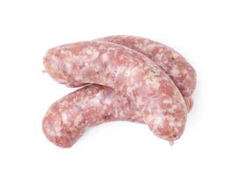 Photo of Fresh raw homemade sausages isolated on white, top view
