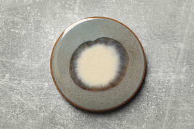 Stylish cup coaster on grey table, top view