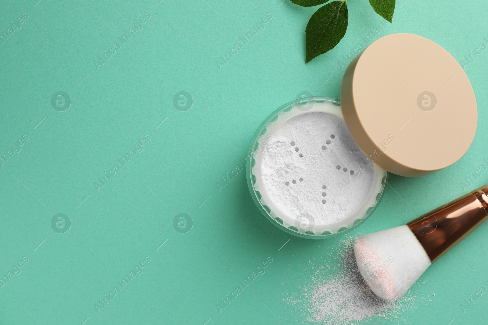 Photo of Flat lay composition with rice loose face powder and makeup brush on turquoise background. Space for text