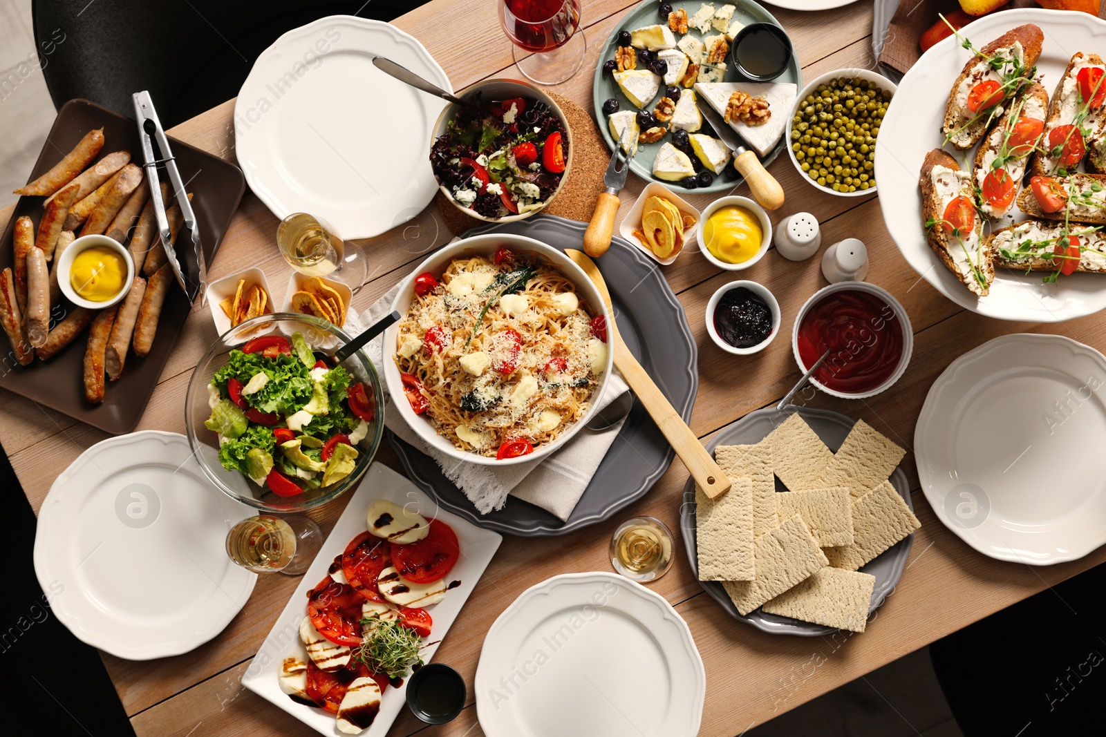 Photo of Brunch table setting with different delicious food indoors, top view