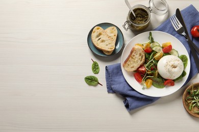 Photo of Delicious burrata salad served on white wooden table, flat lay. Space for text