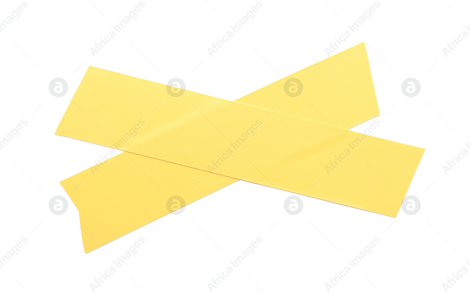 Photo of Cross of yellow insulating tape isolated on white, top view