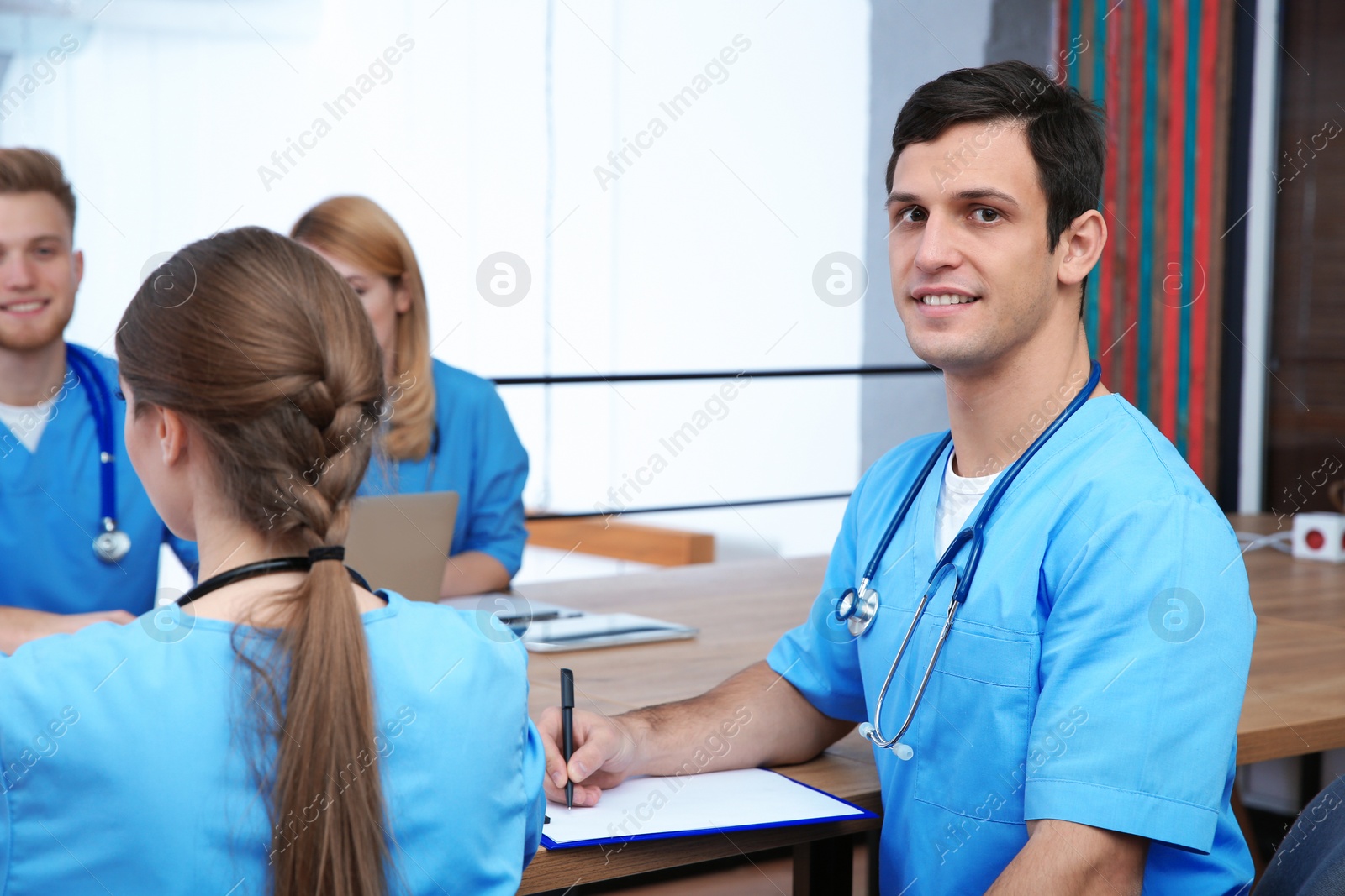 Photo of Medical student with groupmates in university library