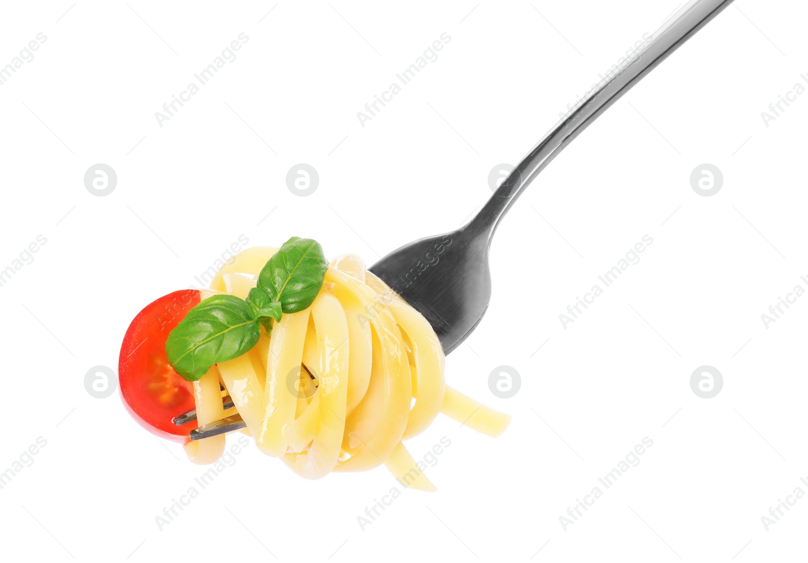 Photo of Fork with tasty pasta, basil and tomato isolated on white