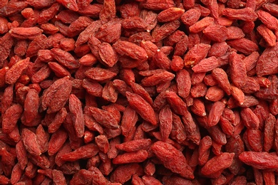 Many dried goji berries as background, closeup. Healthy superfood