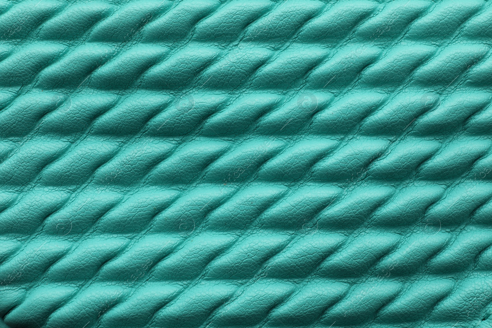 Photo of Texture of turquoise leather as background, closeup