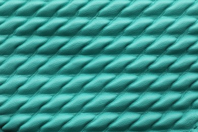 Texture of turquoise leather as background, closeup