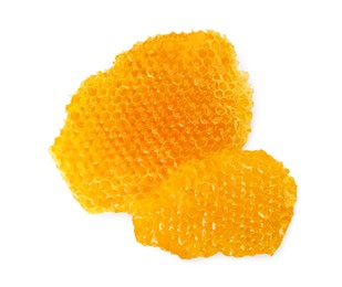 Photo of Pieces of natural honeycomb with tasty honey isolated on white, top view