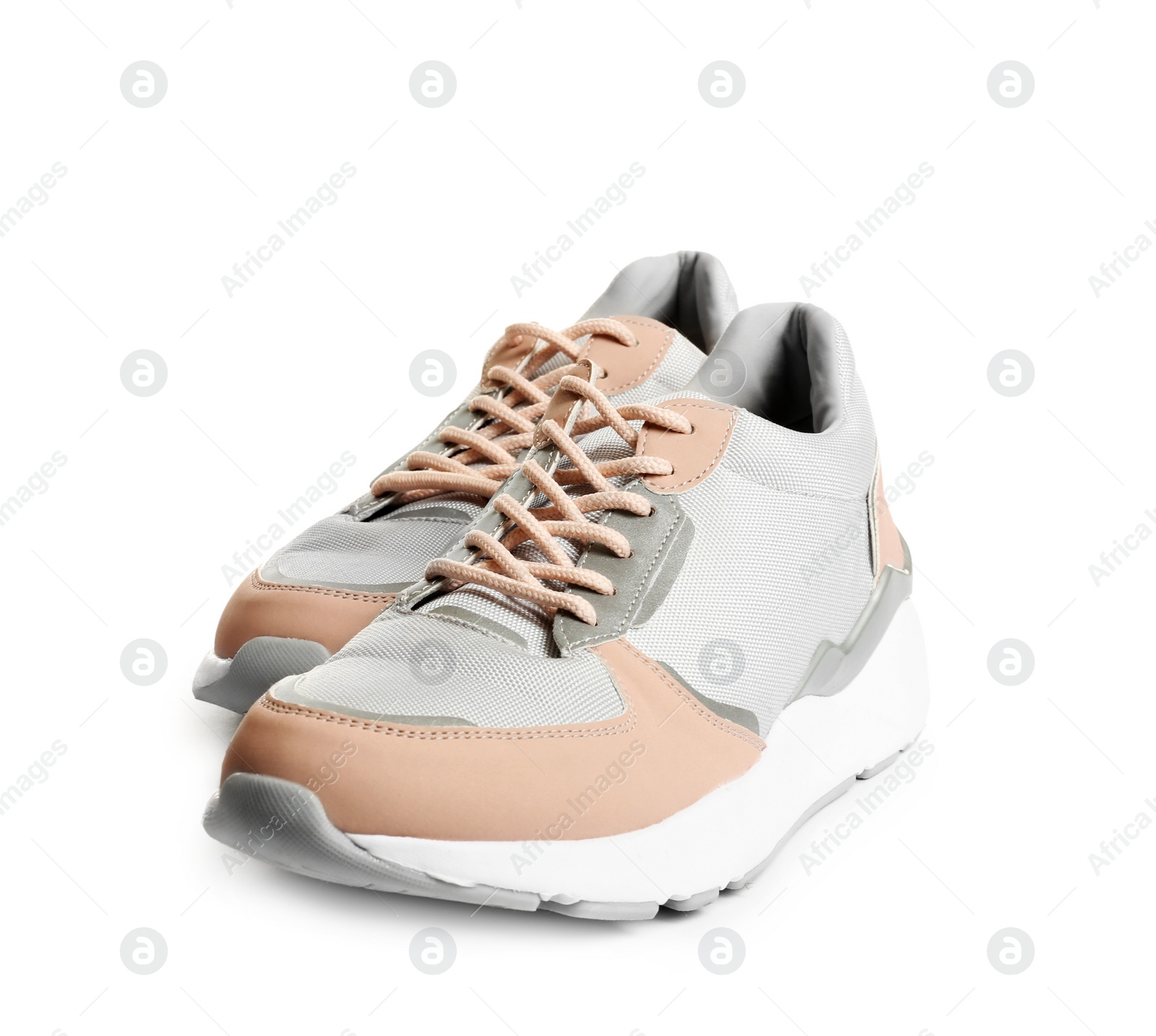 Photo of Pair of sports shoes on white background