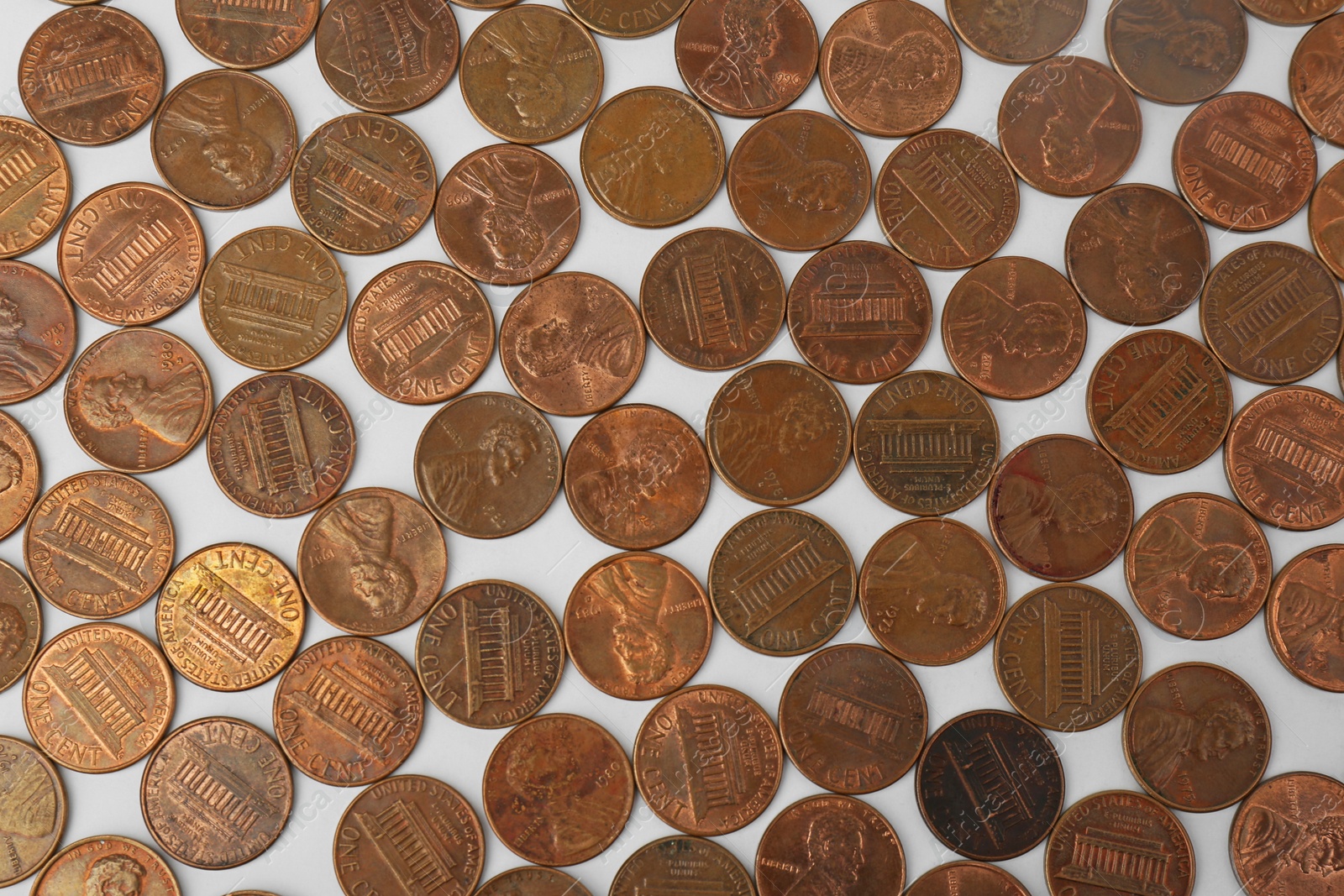 Photo of Many coins on white background, flat lay