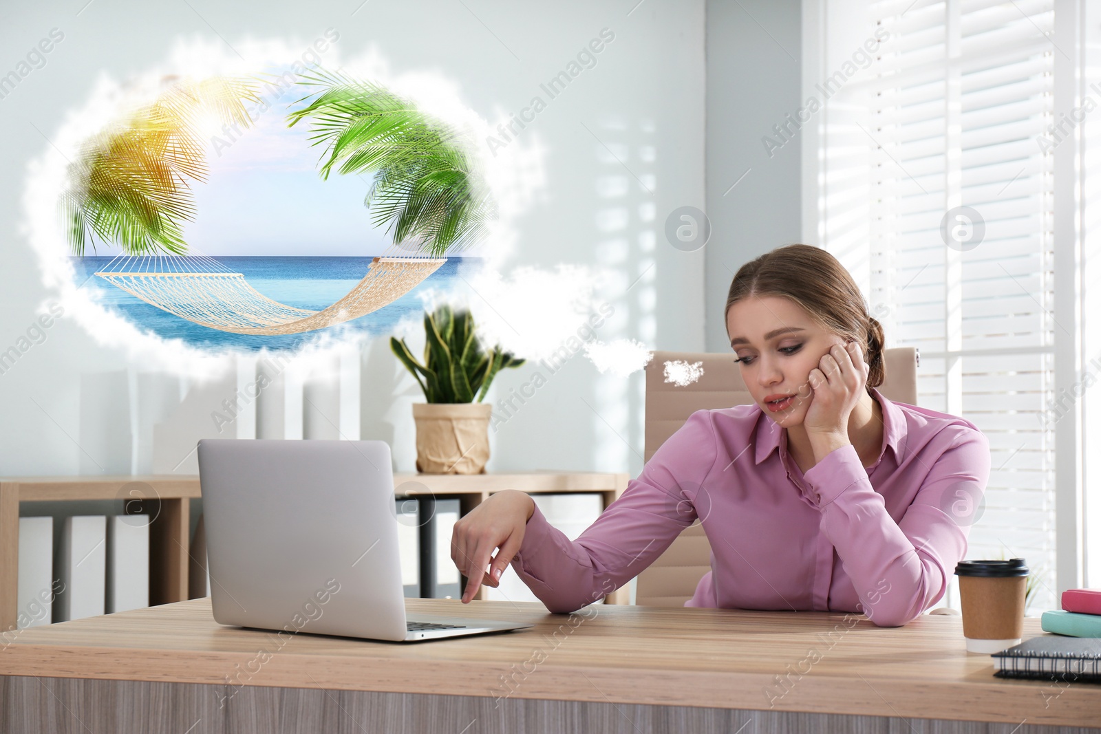 Image of Young woman dreaming about vacation at table in office