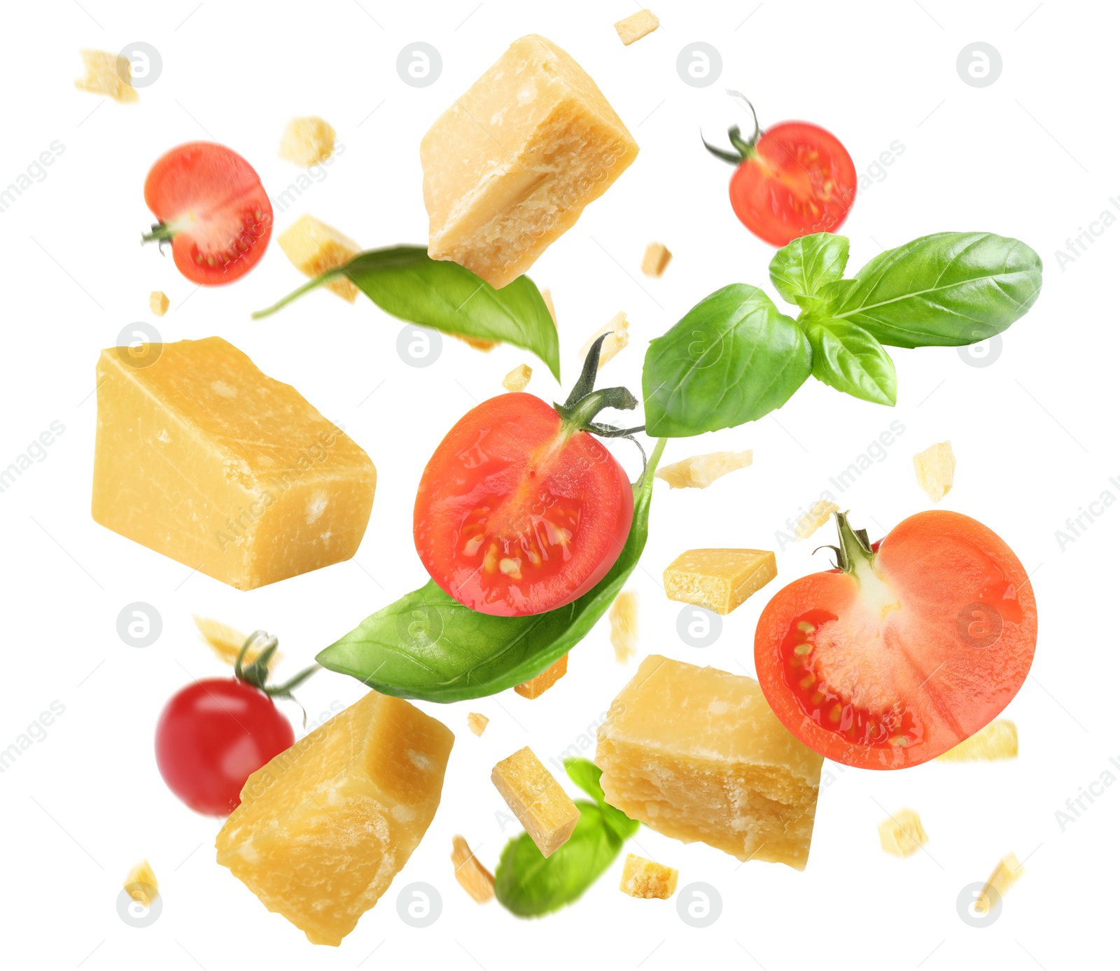 Image of Pieces of delicious parmesan, tomatoes and basil leaves falling on white background