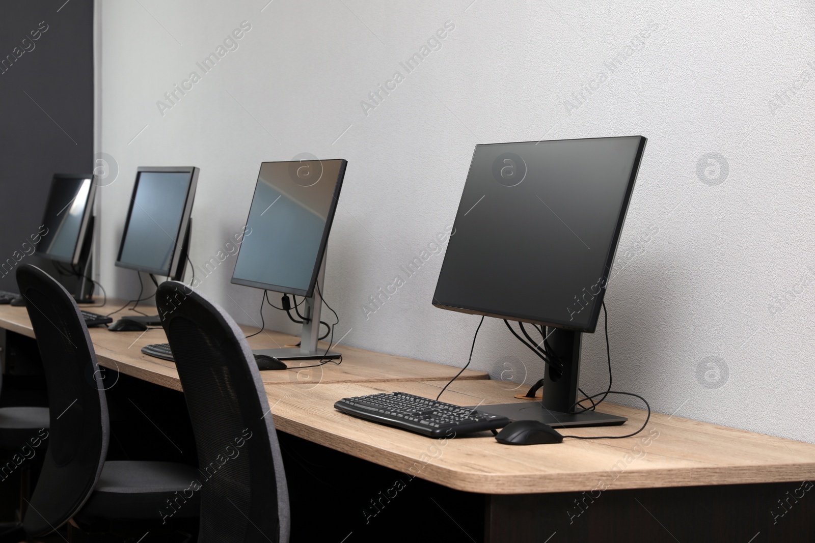 Photo of Many modern computers in open space office