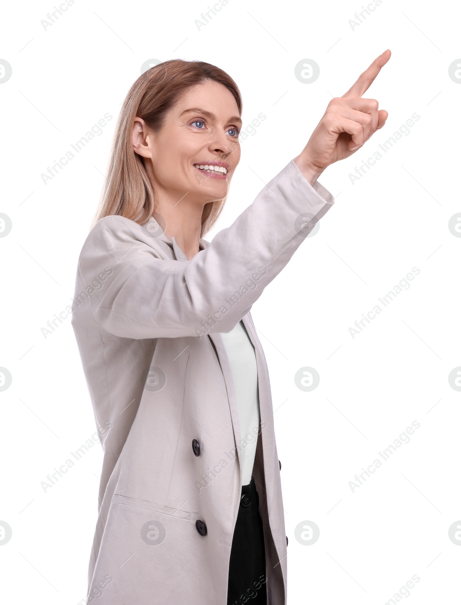 Photo of Beautiful happy businesswoman pointing at something on white background