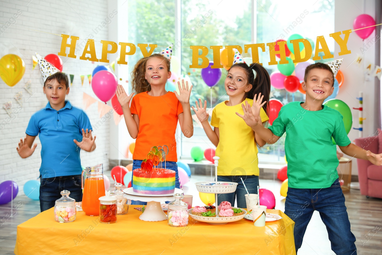 Photo of Happy children at birthday party in decorated room