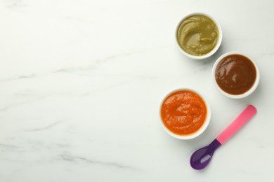 Photo of Bowls with healthy baby food and spoon on white marble table, flat lay. Space for text