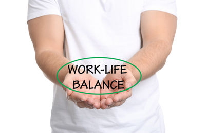 Man demonstrating phrase Work-life balance on white background, closeup