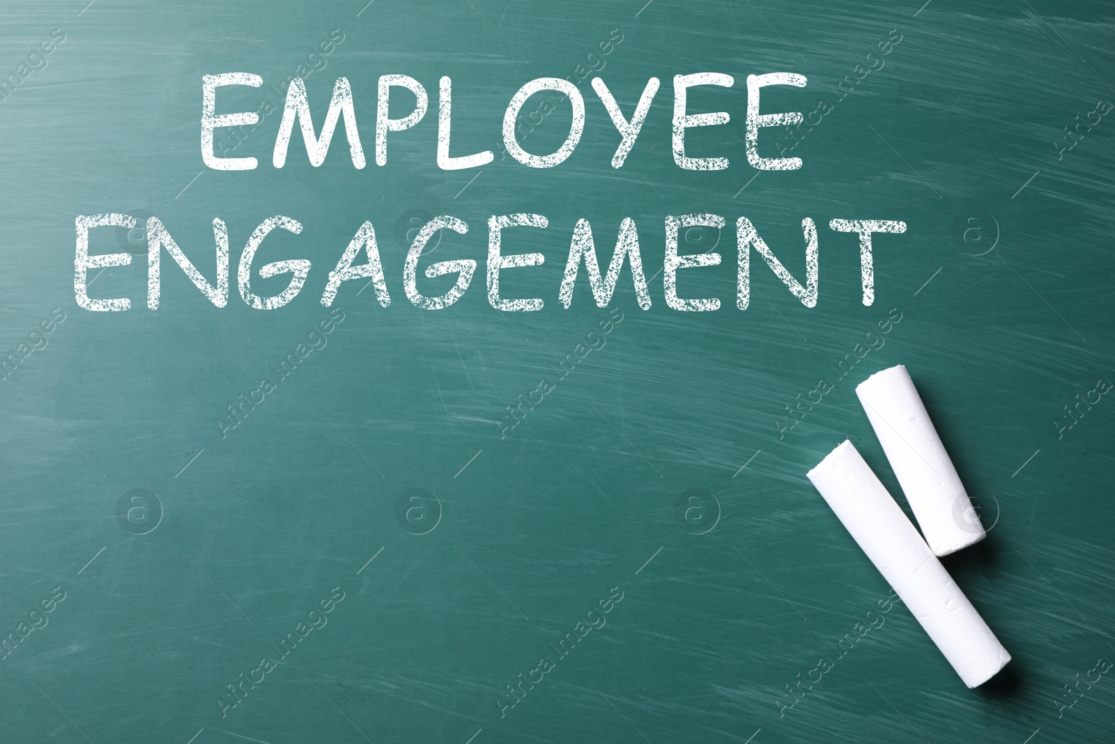 Image of Text Employee Engagement and chalk on greenboard, top view