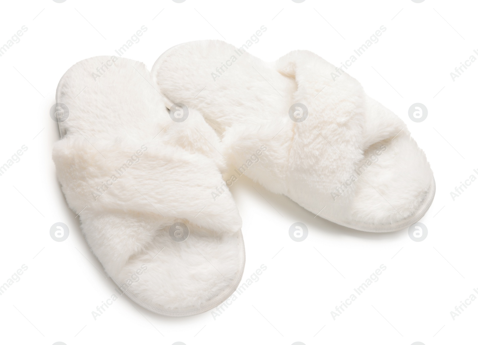 Photo of Pair of soft fluffy slippers on white background