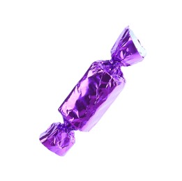 Tasty candy in purple wrapper isolated on white