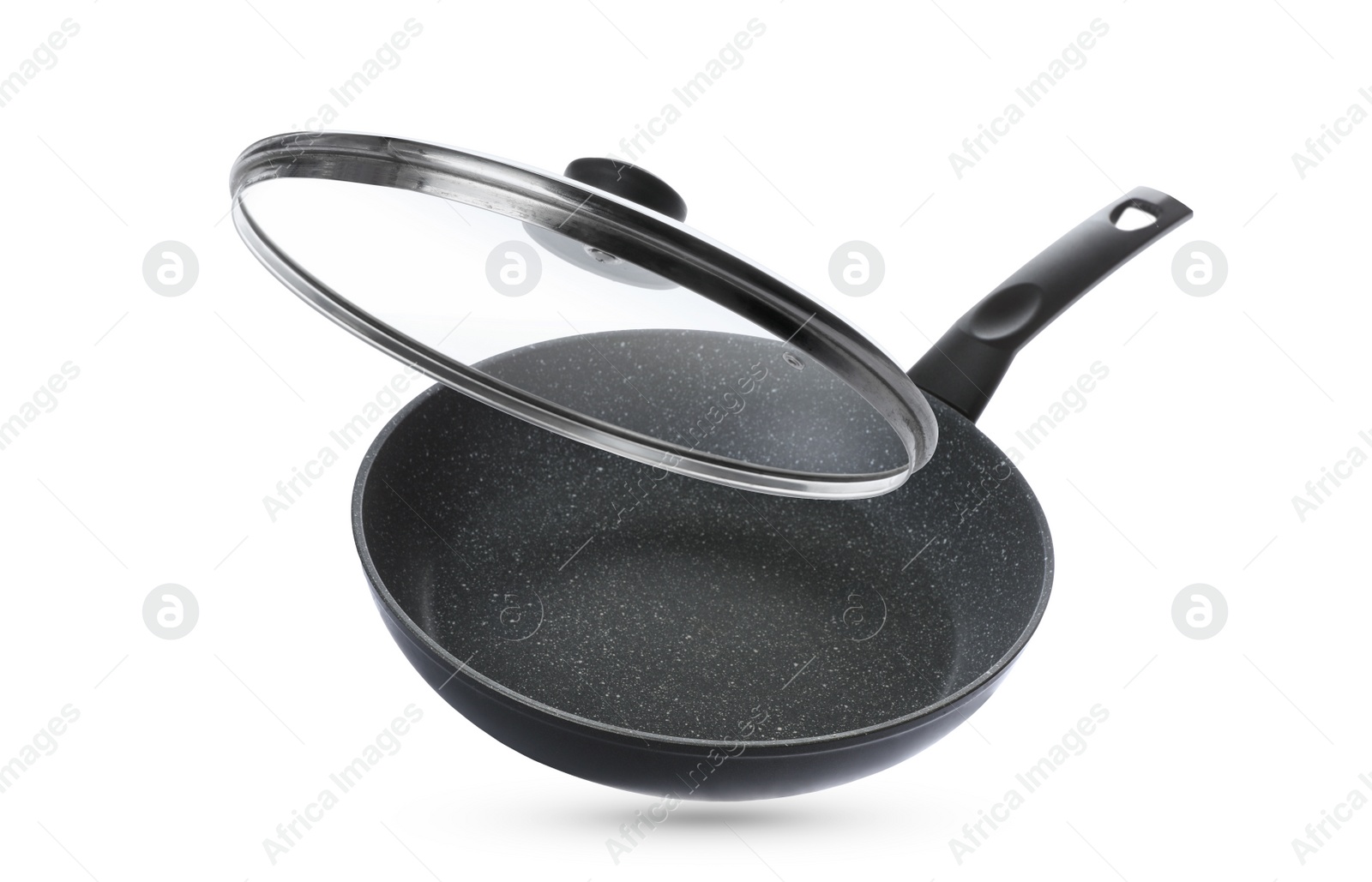 Image of New frying pan and glass lid on white background