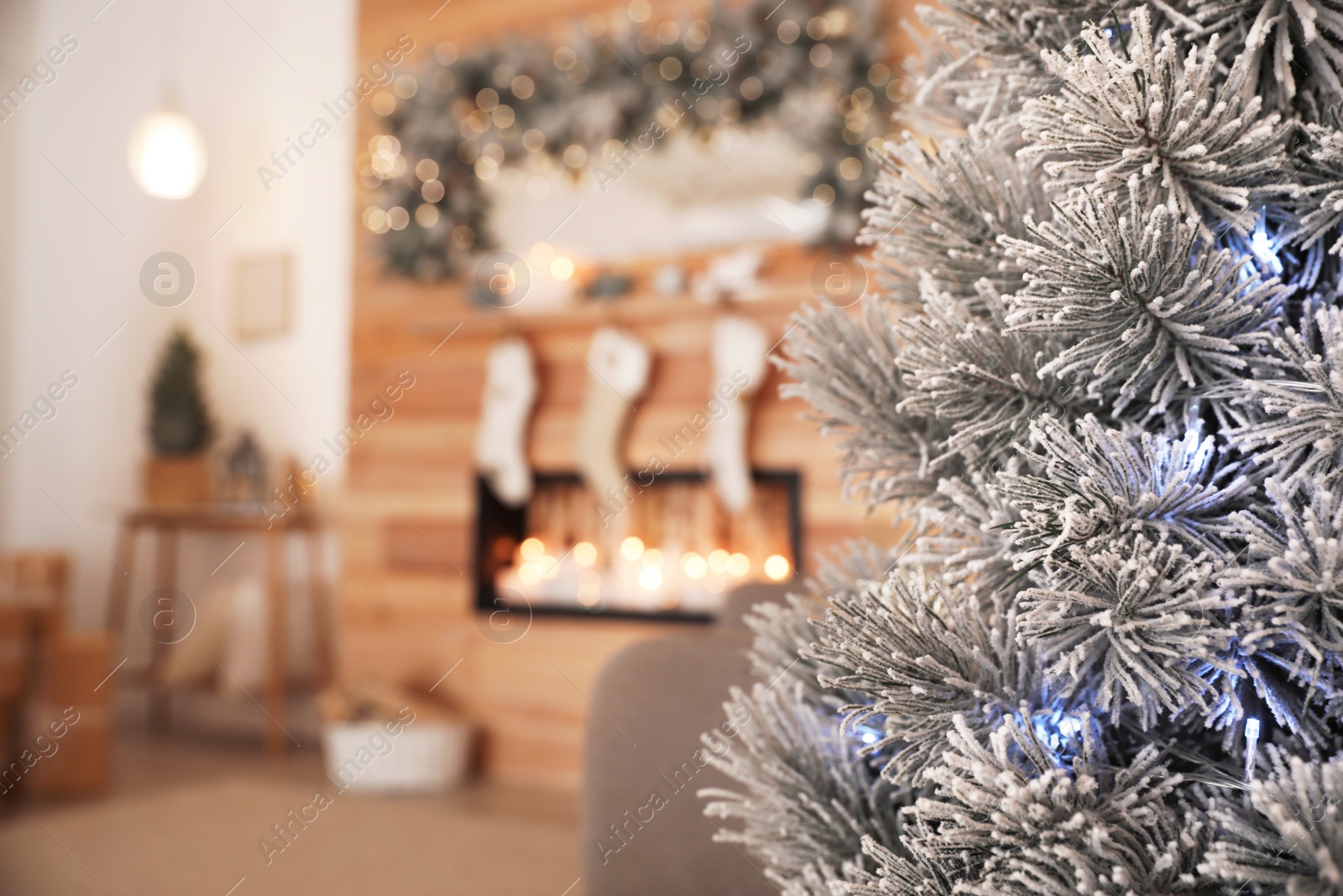 Photo of Beautiful decorated Christmas tree in festive room interior. Space for text