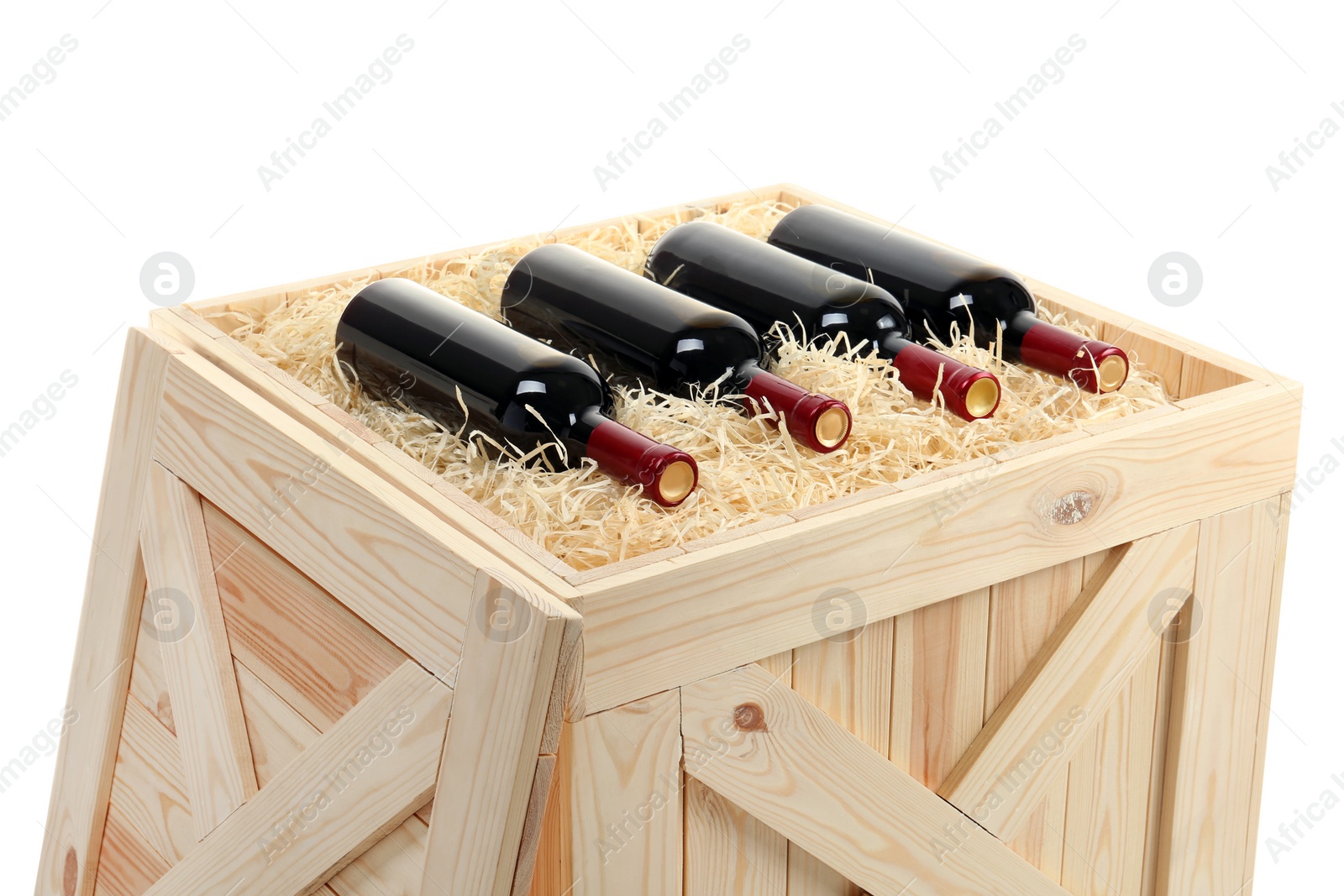 Photo of Bottles of wine in open wooden crate isolated on white