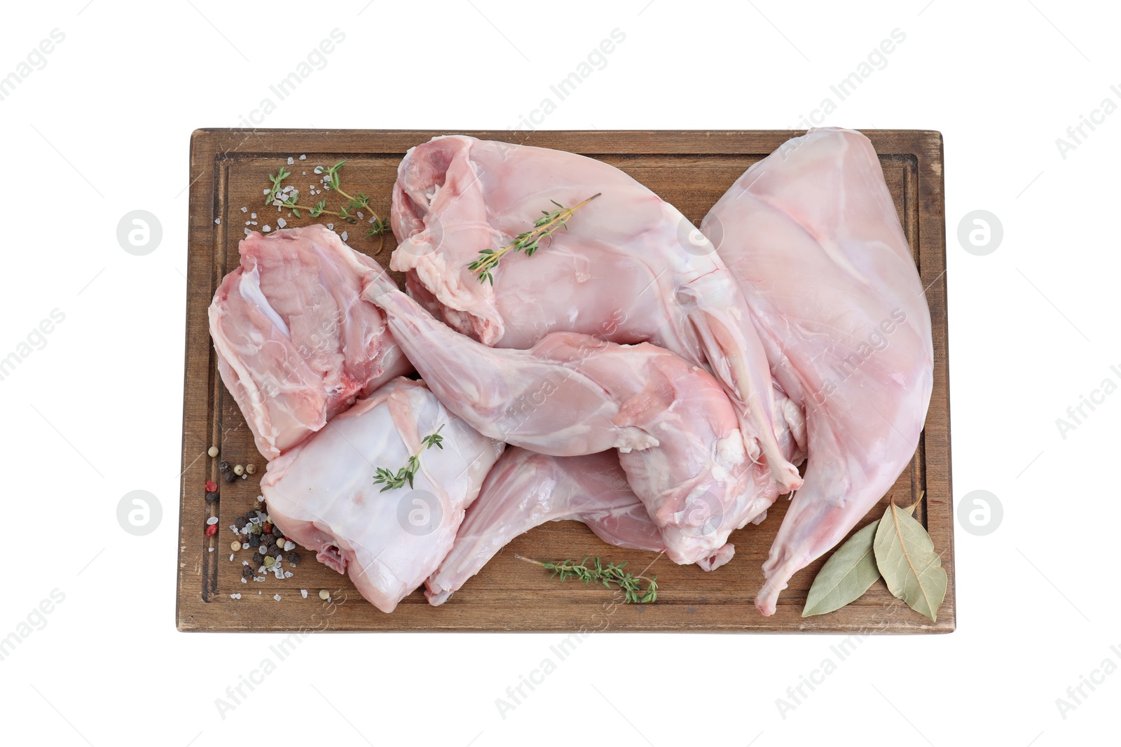 Photo of Fresh raw rabbit legs and spices isolated on white, top view