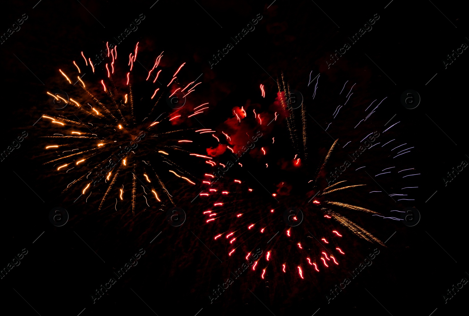 Image of Beautiful bright fireworks lighting up night sky