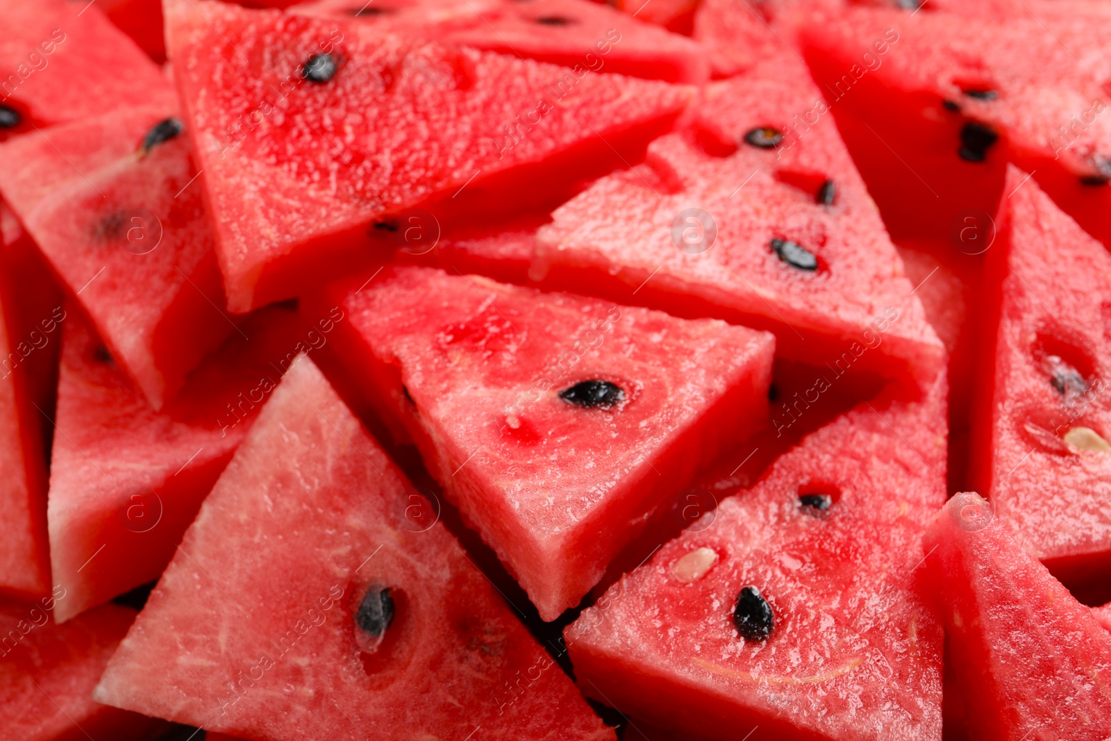 Photo of Delicious fresh watermelon slices as background, closeup