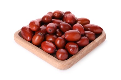 Wooden plate of ripe red dates on white background