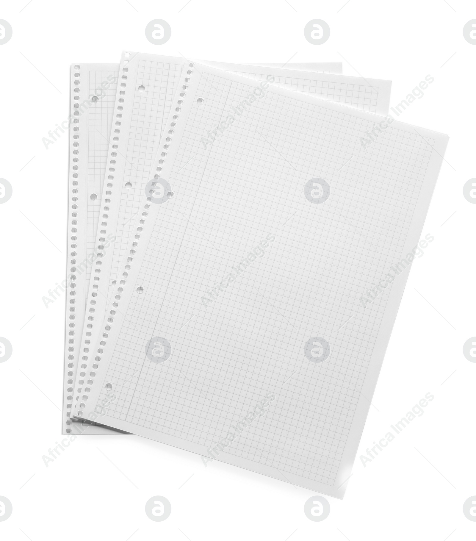 Photo of Stack of checkered paper sheets on white background, top view