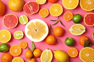 Photo of Different citrus fruits on color background, top view