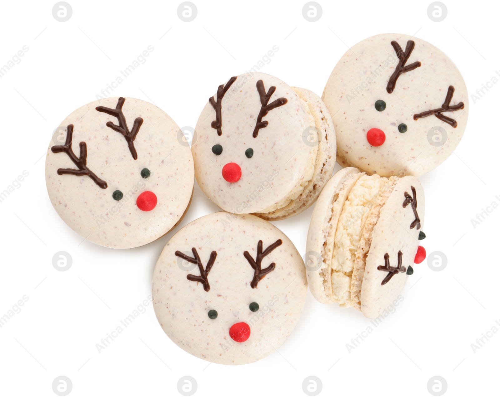 Photo of Tasty reindeer Christmas macarons on white background, top view