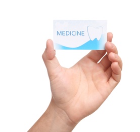 Photo of Man holding business card isolated on white, closeup. Dental medical service