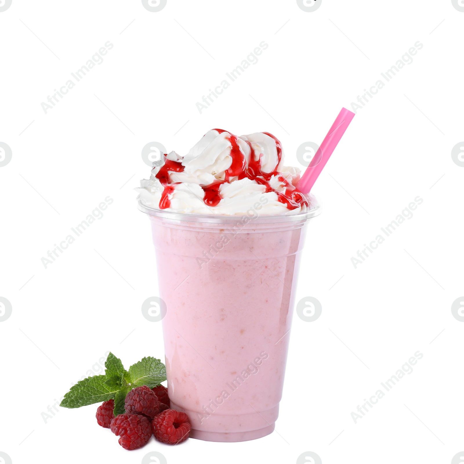 Photo of Tasty fresh milk shake in plastic cup with raspberries on white background