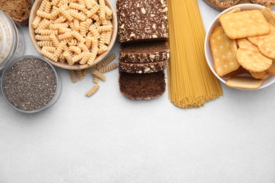 Photo of Different gluten free products on white background, flat lay. Space for text