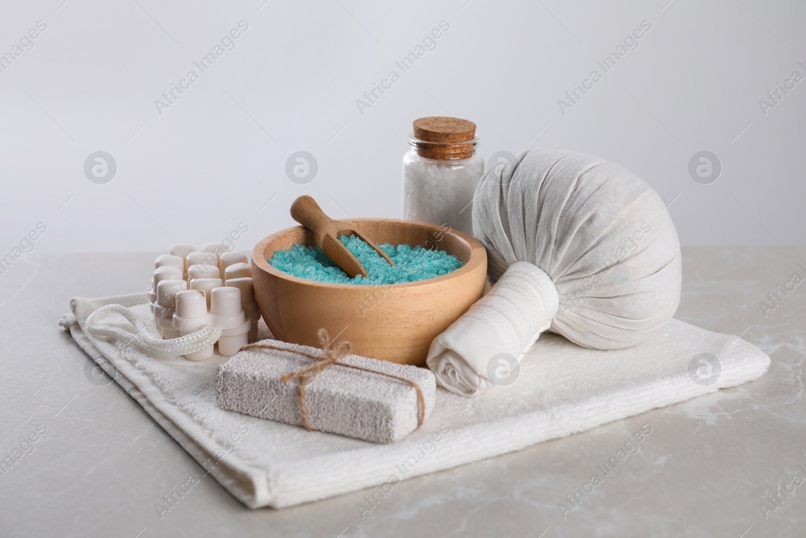 Photo of Spa composition with care products on light grey marble table