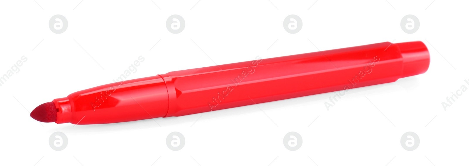 Photo of Bright red marker isolated on white. School stationery