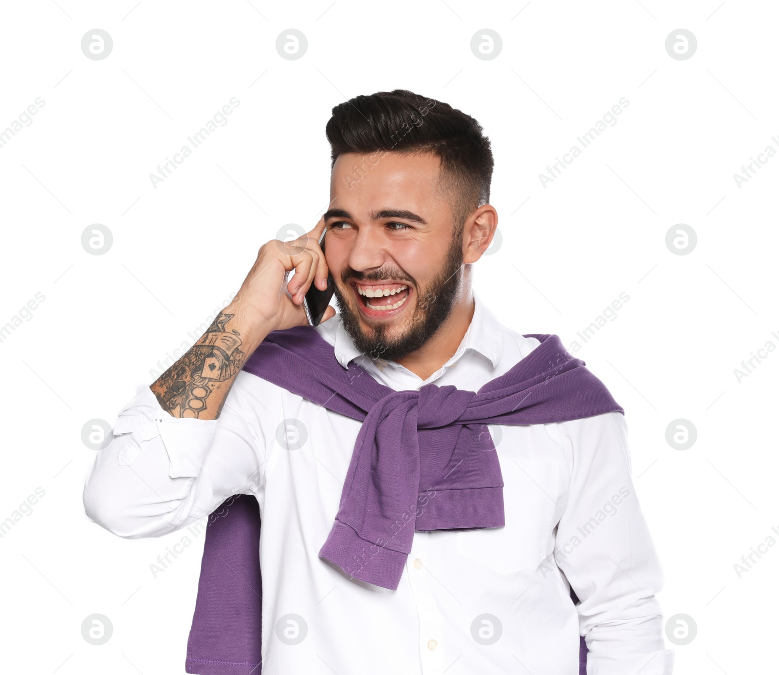 Photo of Portrait of handsome young man with mobile phone on white background