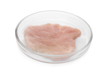 Photo of Petri dish with piece of raw cultured meat on white background