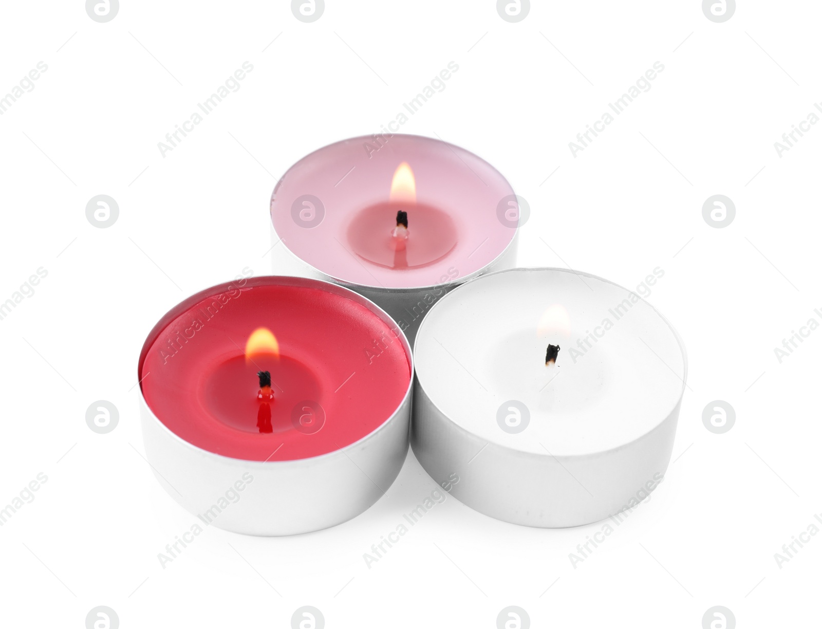 Photo of Burning decorative wax candles on white background