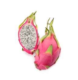 Photo of Delicious cut and whole dragon fruits (pitahaya) on white background, top view