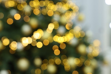 Blurred view of Christmas tree with festive lights