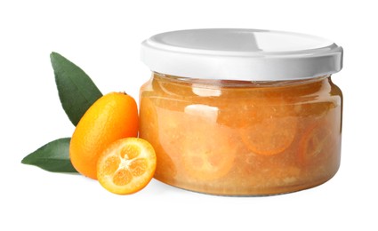 Jar of delicious kumquat jam, fresh fruits and leaves on white background