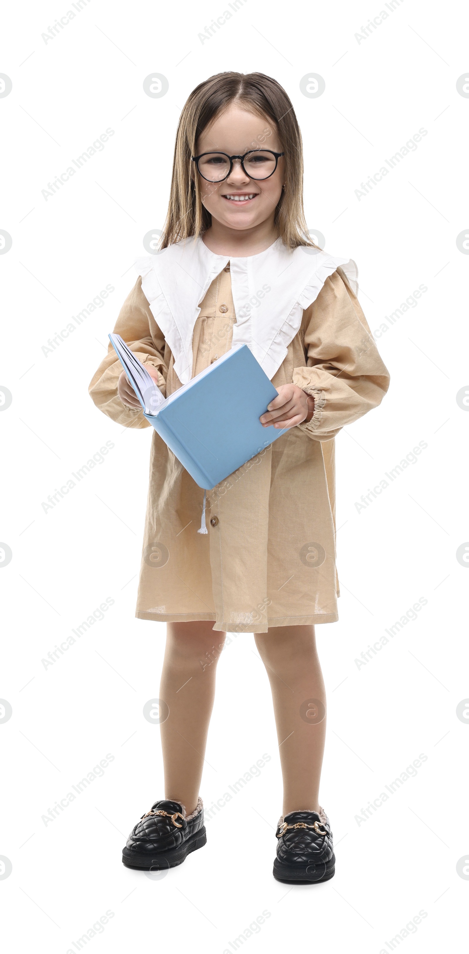 Photo of Cute little girl in glasses with open book on white background