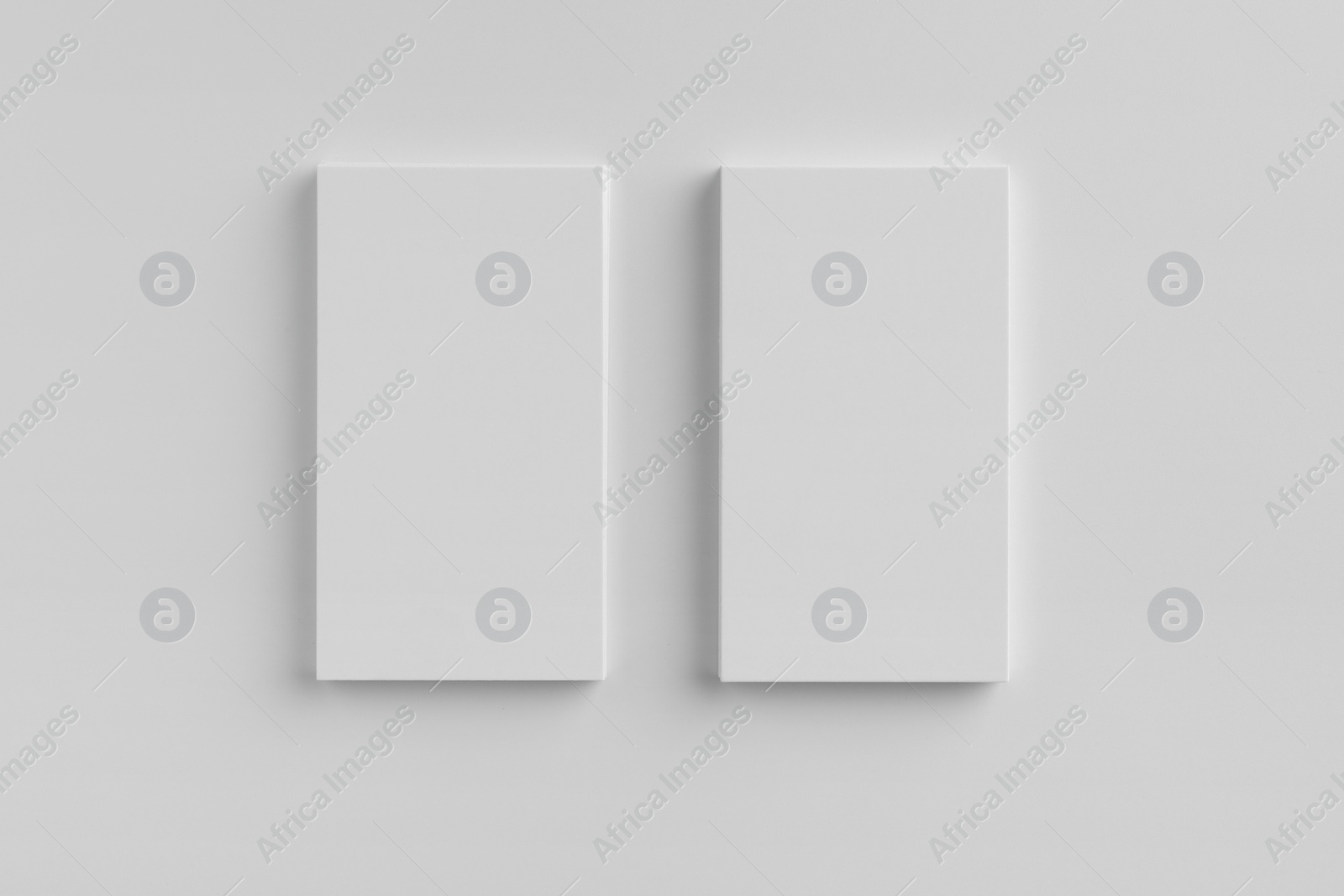 Photo of Blank business cards on white background, top view. Mockup for design