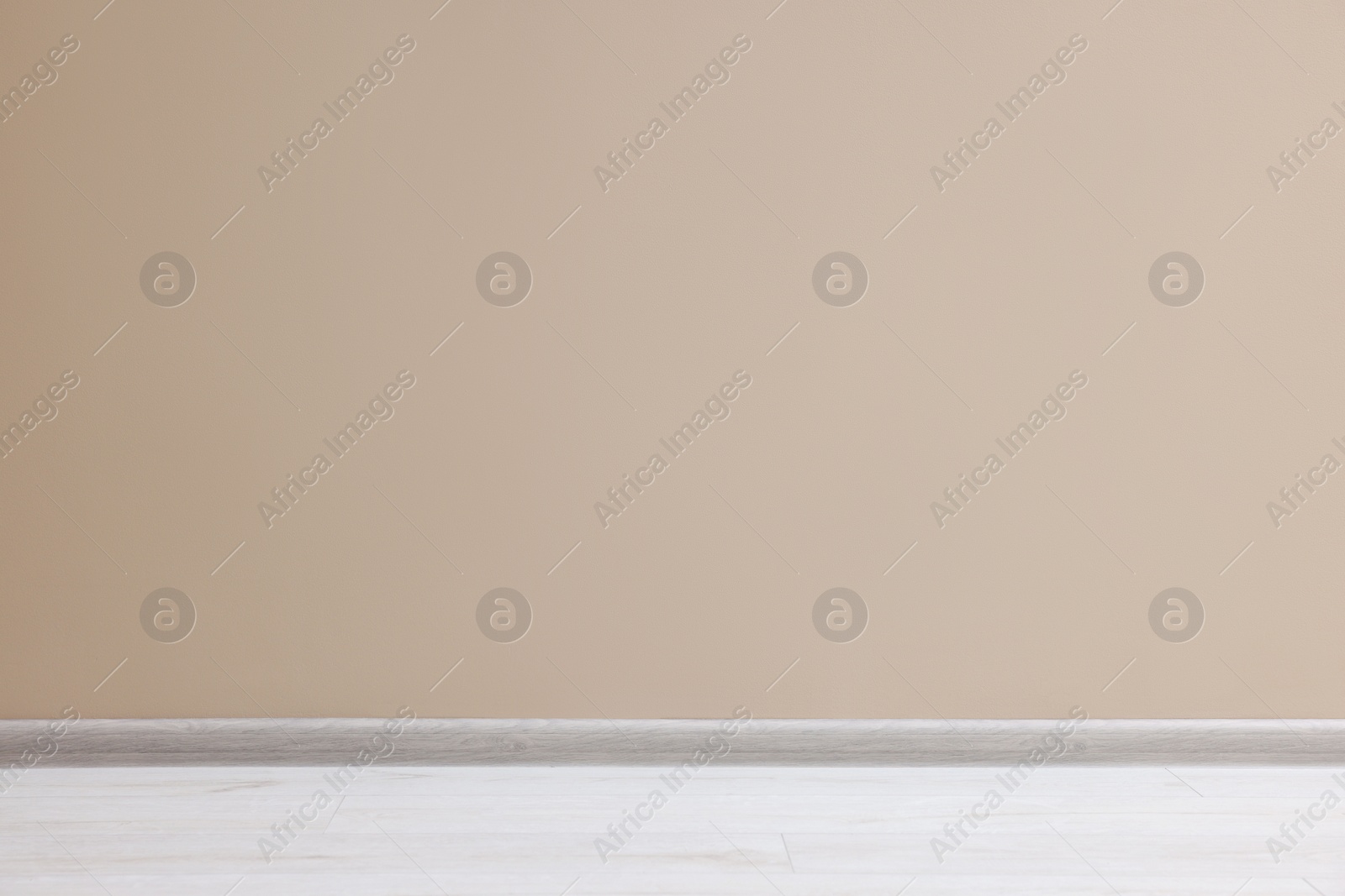 Photo of Beautiful beige wall in clean empty room